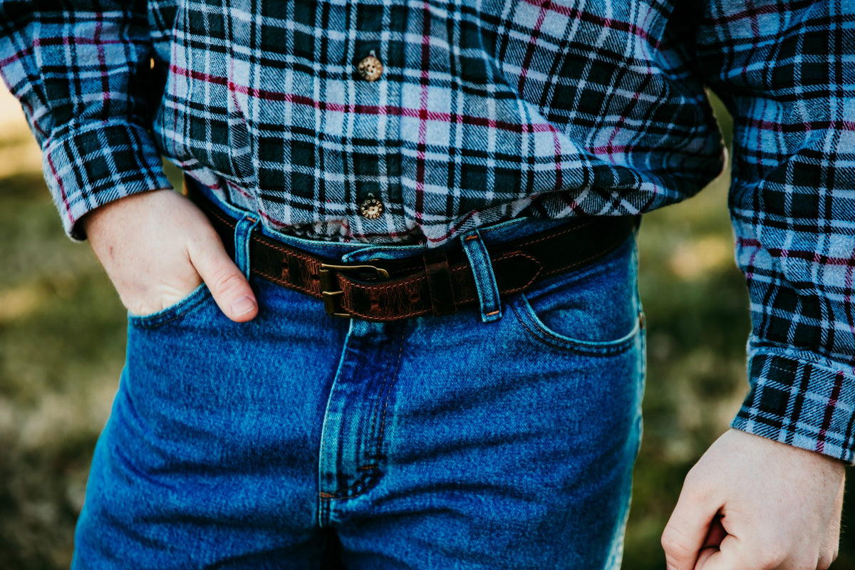 Gerald water buffalo leather belt in dark brown worn with jeans