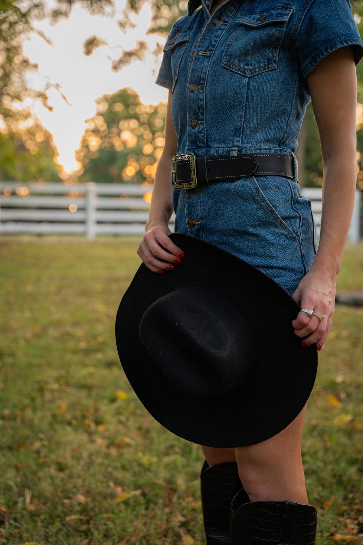 Austin black leather belt worn with denim, ornate silver buckle