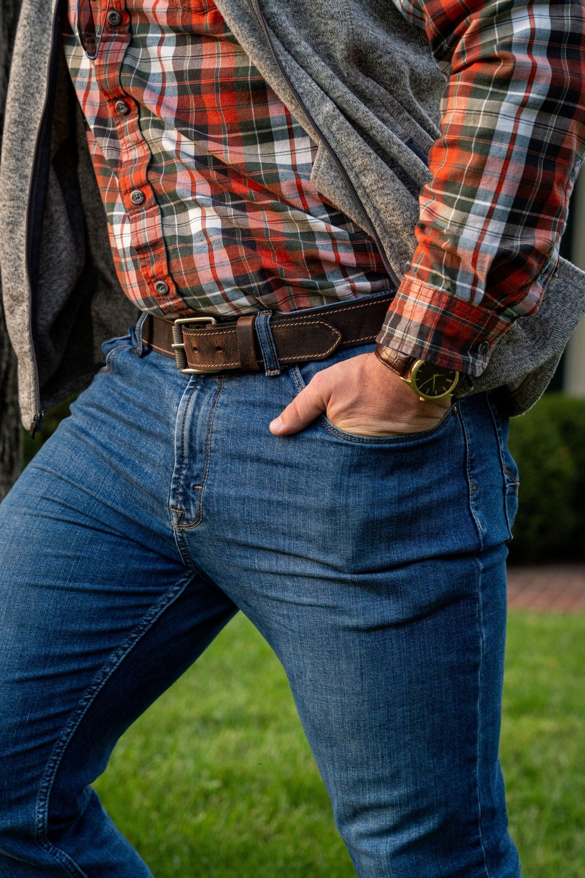 Man wearing Wallace water buffalo belt with antique silver roller buckle