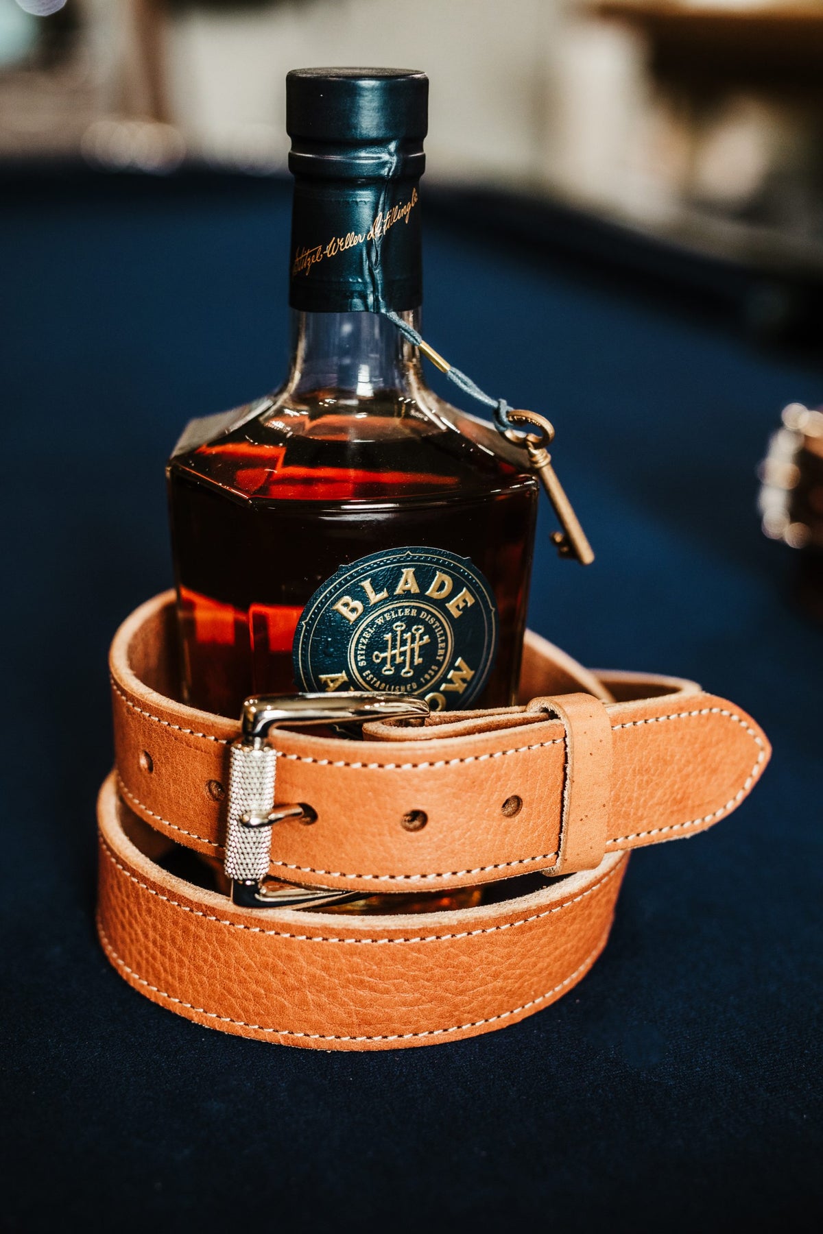 The Saturday harness leather belt in tan with polished engraved roller buckle