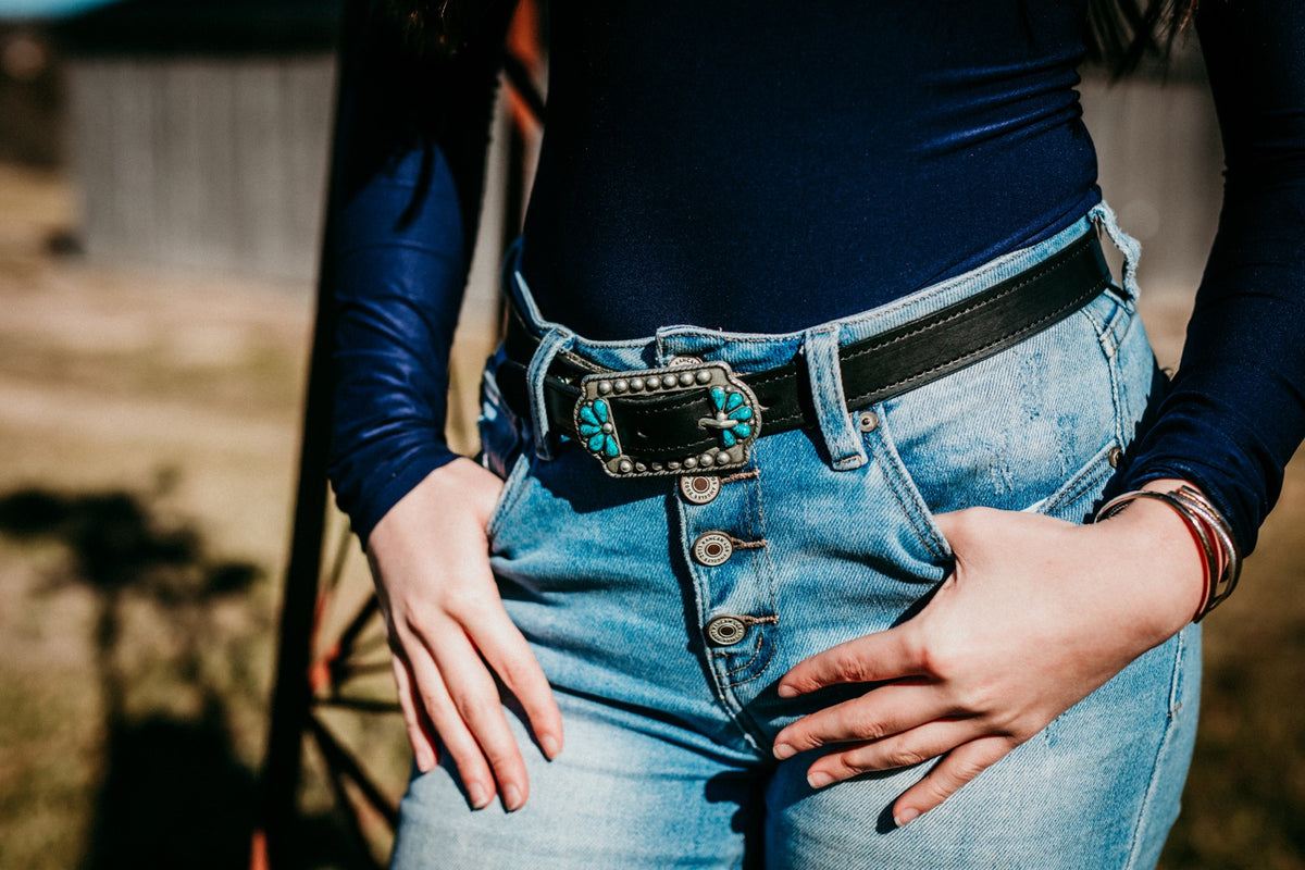 Woman wearing Sara bridle leather belt with turquoise center bar buckle