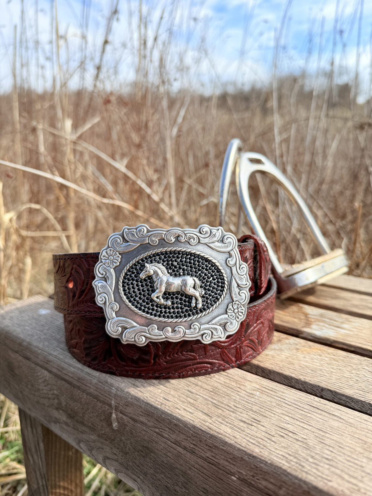 The Bridle Rose floral tooled leather belt with horse and crystal buckle