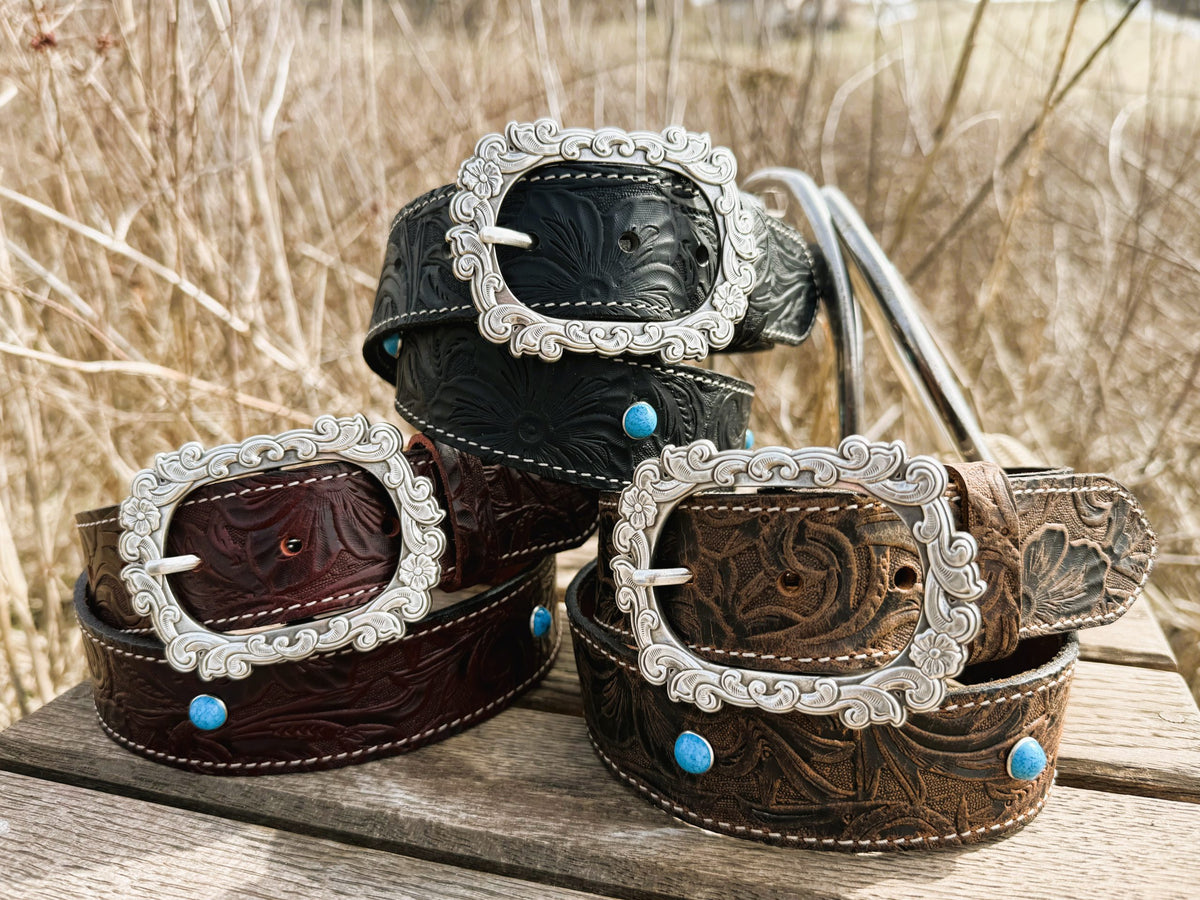 Mae embossed water buffalo leather belts with floral tooling and turquoise spots