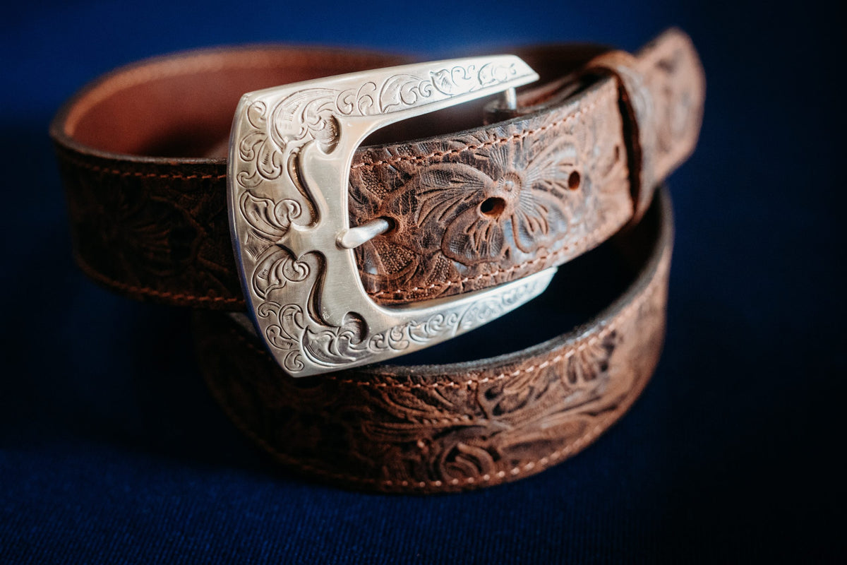 Reagan floral-embossed water buffalo belt with engraved silver buckle