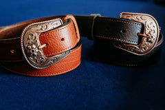 Jesse British tan belt shown beside black western belt, copper buckles