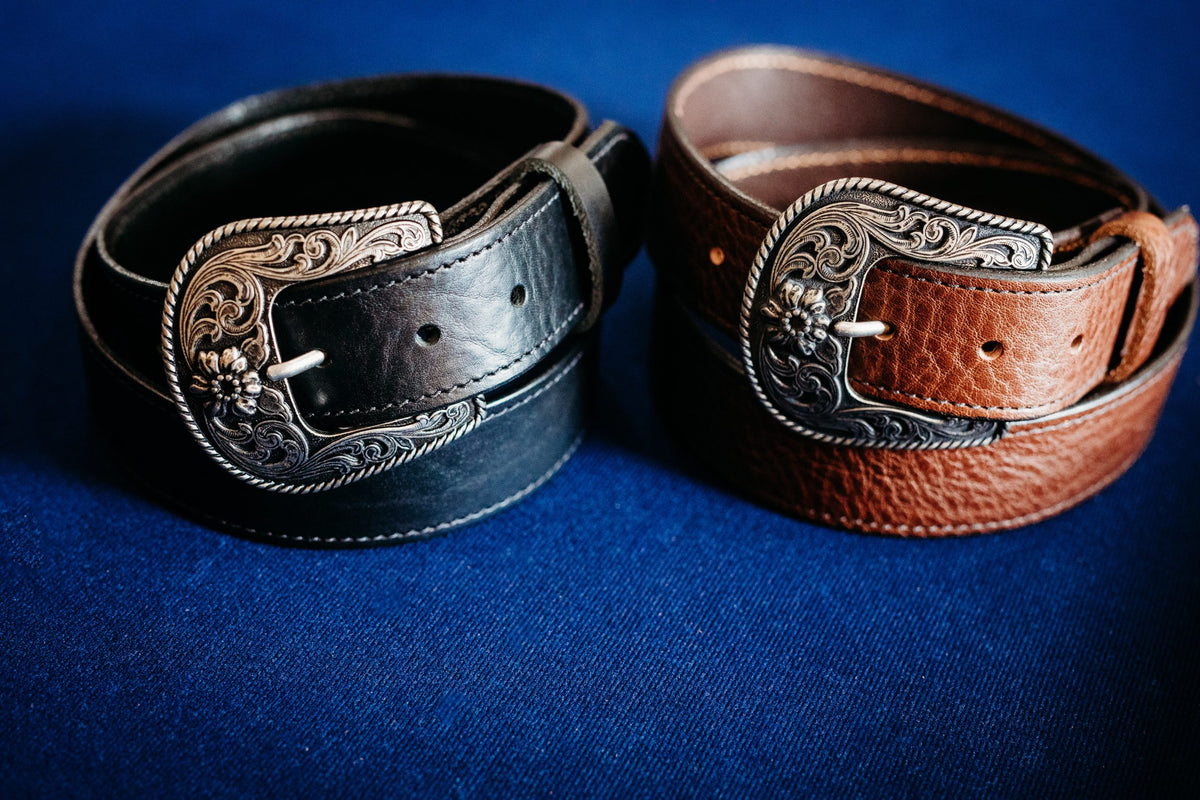 Sterling black belt paired with chocolate western belt, engraved silver buckles