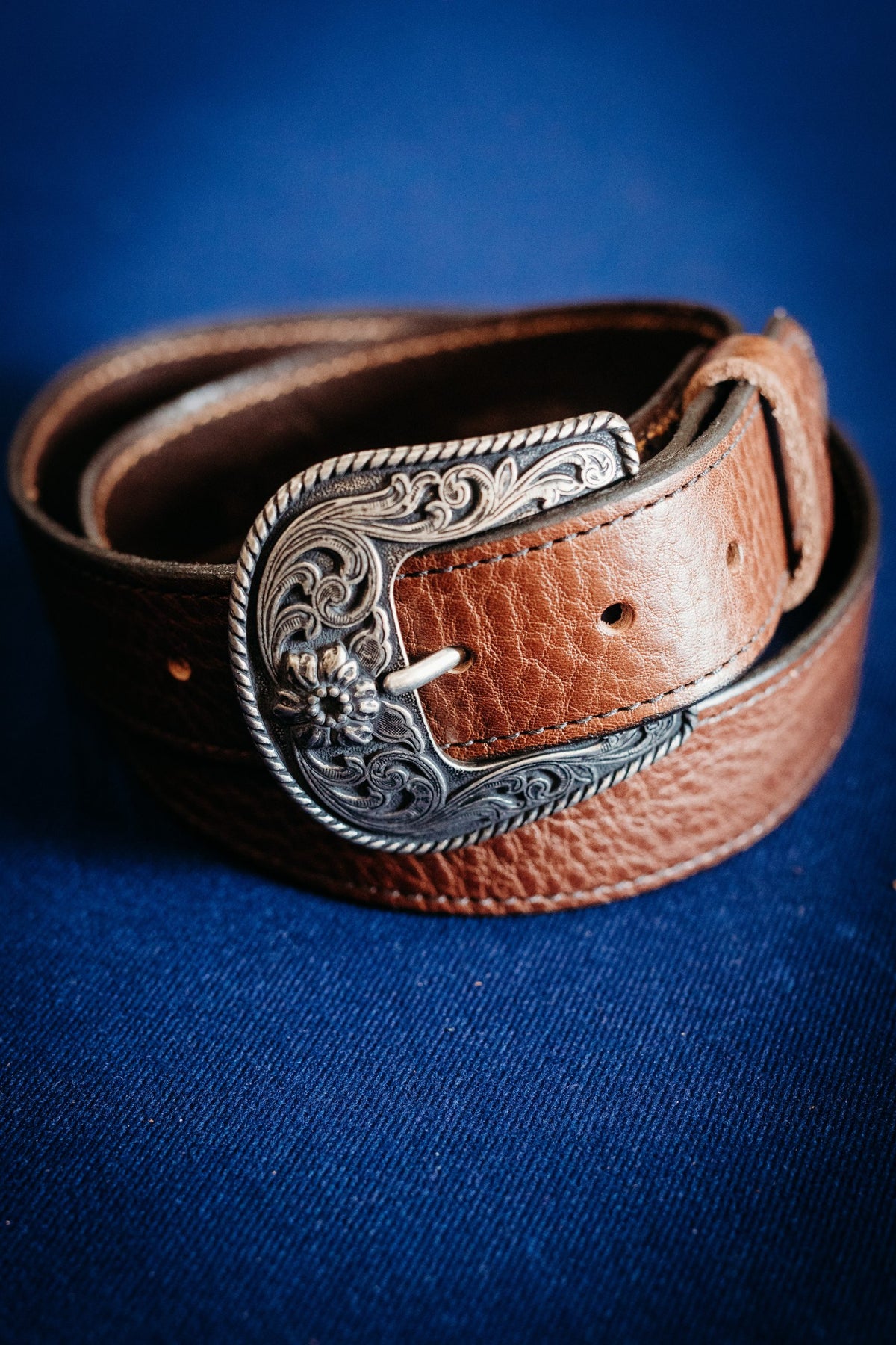Wyatt chocolate full grain leather belt with engraved black and silver buckle