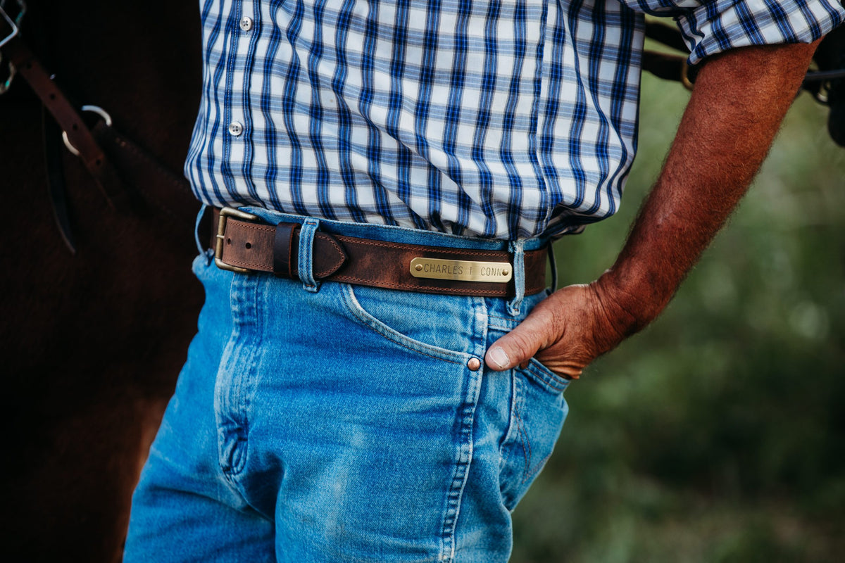 Man wearing Work Belt nameplate belt in brown water buffalo leather
