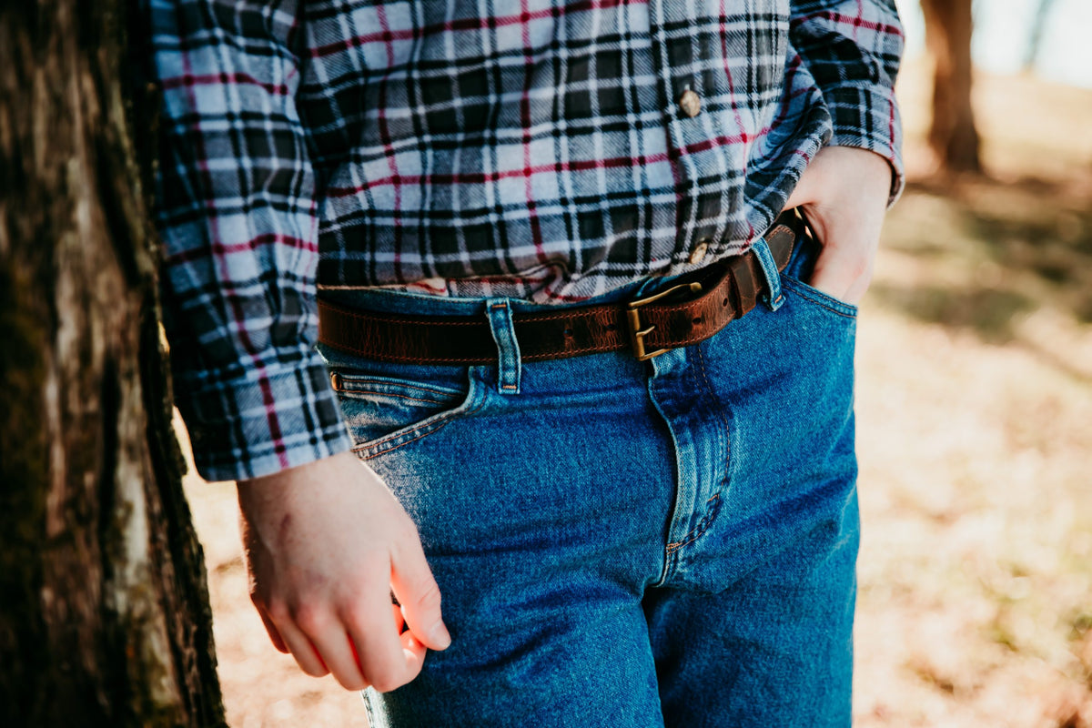 Gerald full grain leather belt in dark brown worn with jeans