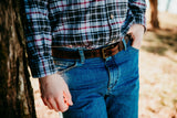 Gerald full grain leather belt in dark brown worn with jeans