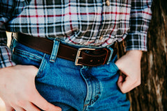Taylor chocolate water buffalo belt worn, stainless roller buckle close-up