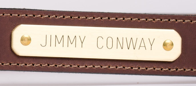Engraved brass nameplate on traditional brown water buffalo leather belt
