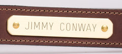 Engraved brass nameplate on traditional brown water buffalo leather belt