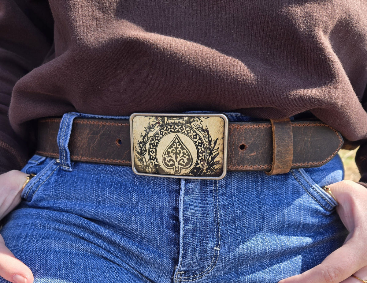 Woman wearing Ace of Spades distressed water buffalo belt with jeans