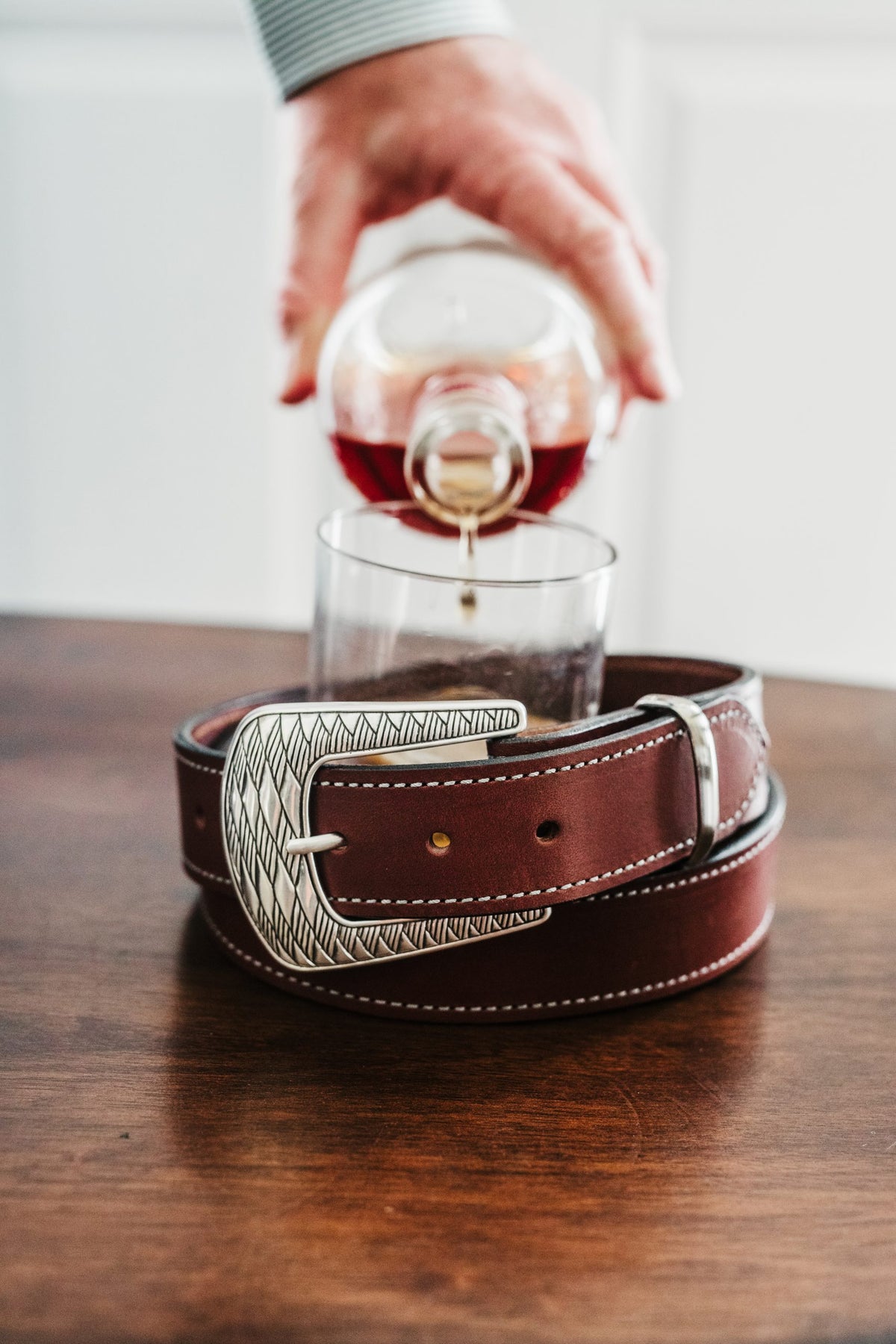 Jackson bridle leather belt in burgundy with ornate silver Western buckle