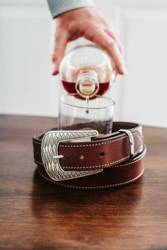 Jackson bridle leather belt in burgundy with ornate silver Western buckle