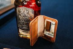 Front Pocket Wallet open in Buck Brown harness leather with cash in money clip