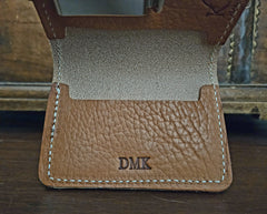 DMK monogram embossed on buck brown harness leather front pocket wallet