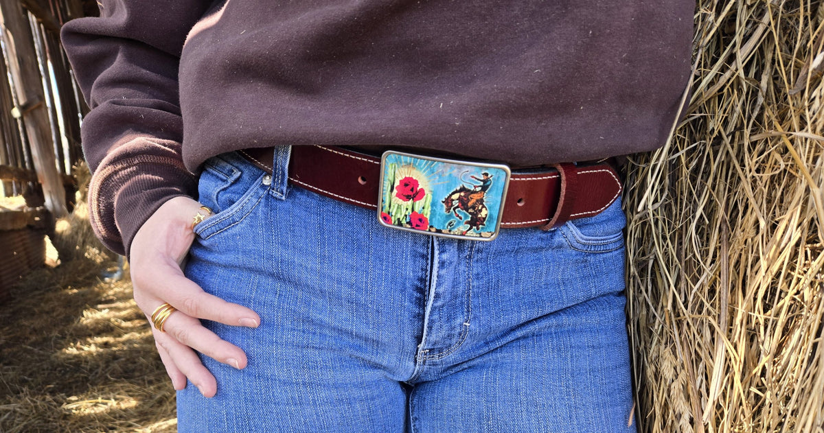Woman wearing Bucking Bronc crimson water buffalo belt with jeans