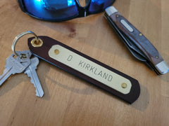 Personalized leather keytag with engraved brass nameplate on split key ring