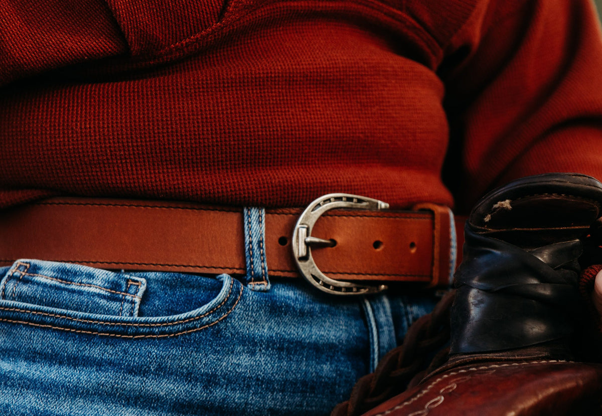 The Shoe horseshoe buckle worn with jeans, golden brown water buffalo leather