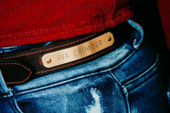 Distressed brown water buffalo nameplate belt, engraved brass plate close-up