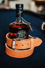 The Saturday harness leather belt in tan with polished engraved roller buckle