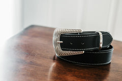 Clint black water buffalo belt, silver buckle and white contrast stitching