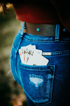 Ella leather belt with turquoise stud accents worn with jeans, rear view