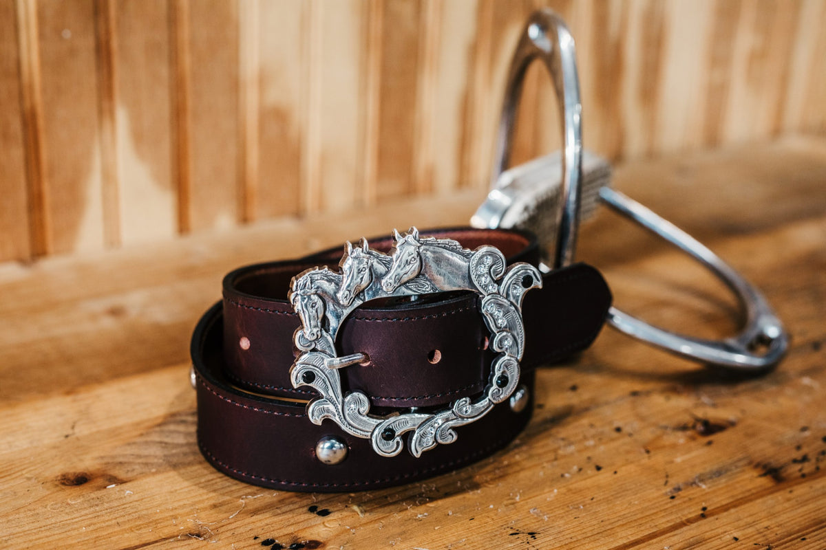 Leah water buffalo leather belt in burgundy with crystal horse head buckle