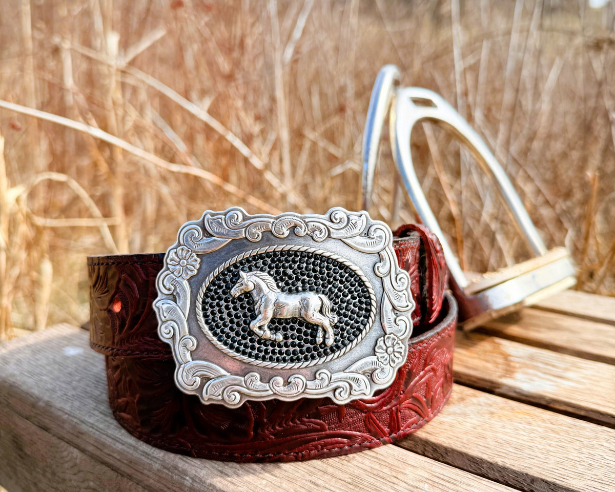 The Bridle Rose burgundy embossed water buffalo belt with silver horse buckle