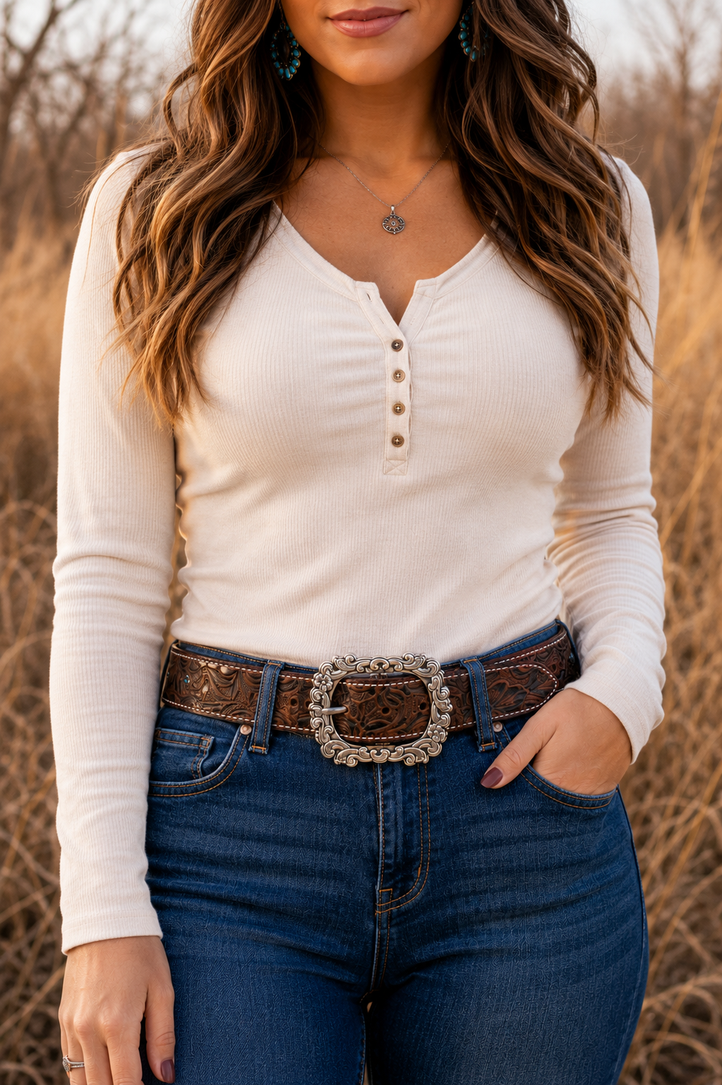Woman wearing Sadie embossed water buffalo leather belt with denim