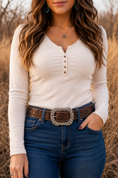 Woman wearing Sadie embossed water buffalo leather belt with denim