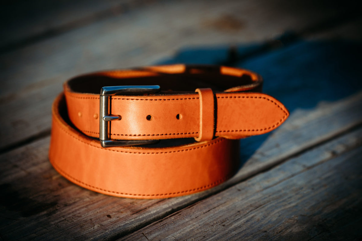 The Duke bridle leather belt in russet tan with roller buckle