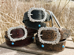 Georgia embossed water buffalo leather belts shown in three tooled colorways